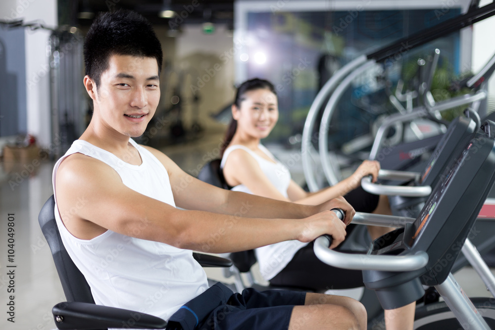 young people working out in modern gym