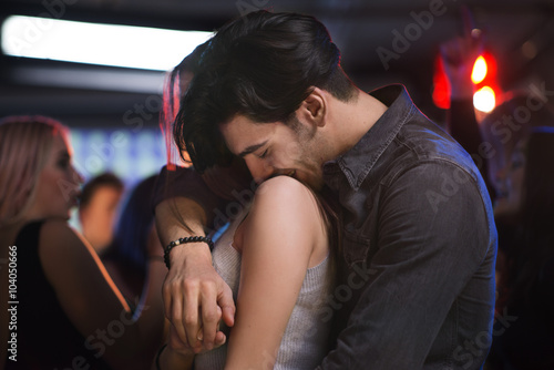 Beautiful couple dancing at bar