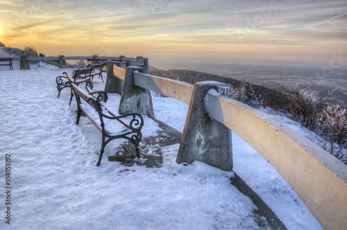 Jested - bench on the patio overlooking the winter landscape.. Liberec, Bohemia, Czech Republic. Beautifull sunny day.