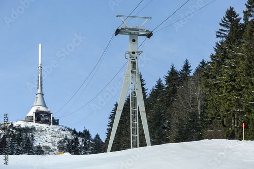 Transmitter and lookout tower in a winter landscape on the hill Jested. photo