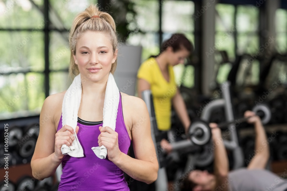 Fit woman posing while holding towel Fit woman posing while holding towel