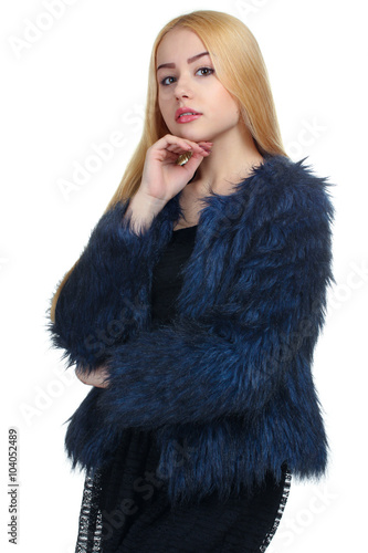 girl in black dress and in a blue coat standing on white isolated background
