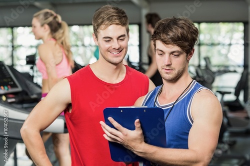 Male trainer discussing about performance