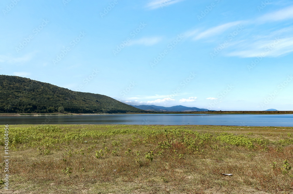 Fototapeta premium Beauty look toward picturesque Rabisha lake and mountain over Magura cave, Belogradchik, Bulgaria 