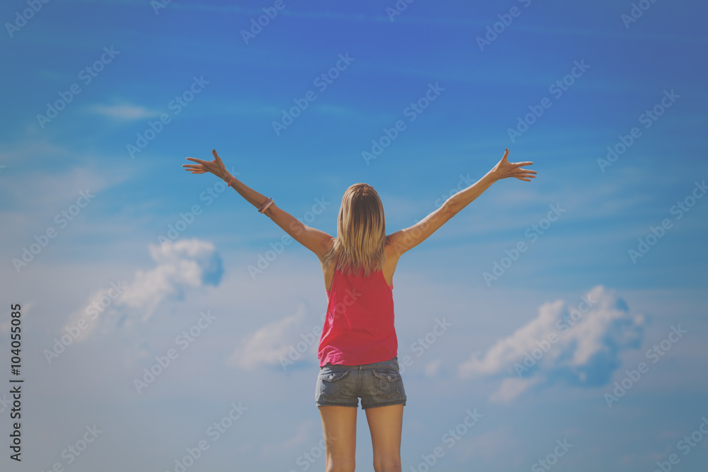 Girl feeling free with clouds in the background. Girl feeling free with clouds in the background.