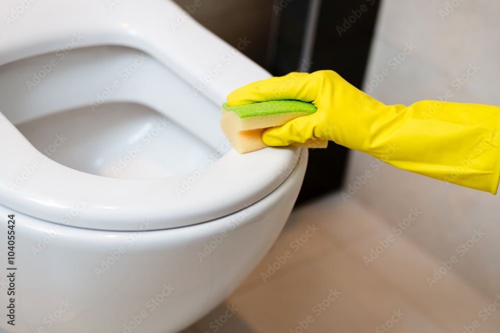 cleaning toilet in wc with yellow sponge cleaning toilet in wc with yellow sponge