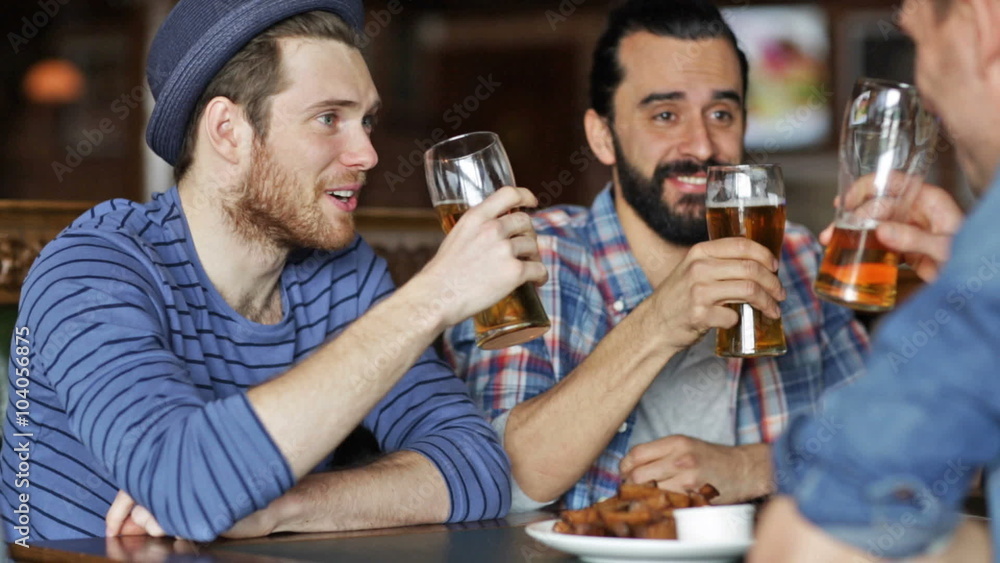 happy male friends drinking beer at bar or pub happy male friends drinking beer at bar or pub