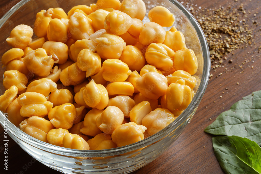 chickpeas on the wooden surface and basil chickpeas on the wooden surface and basil