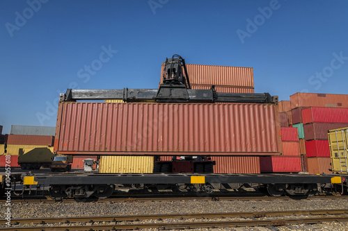 Wallpaper Mural forklift handling and train with container in shipyard for Logistic Import Export background Torontodigital.ca