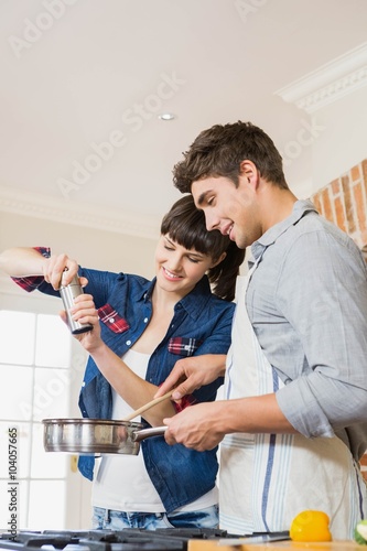 Woman pouring salt into utensil