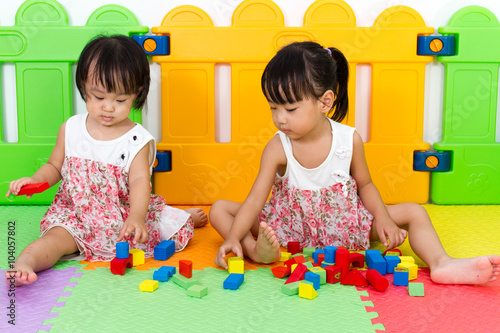 Asian Little Chinese Girls Playing Wooden Blocks