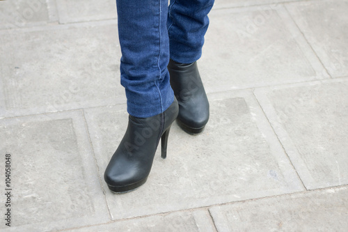 Girl's leg with boots on high heel