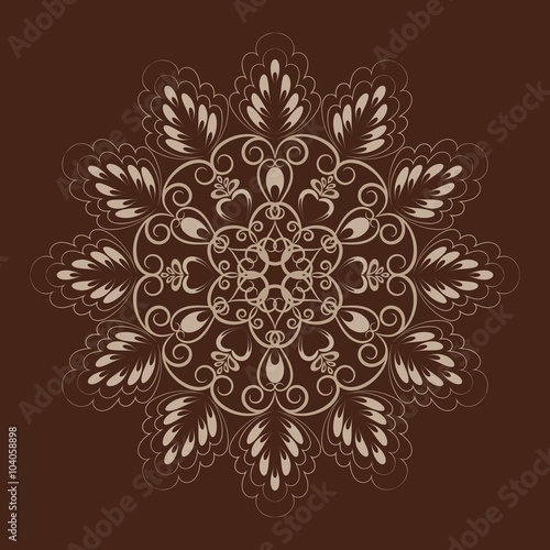Flower mandala over dark brown