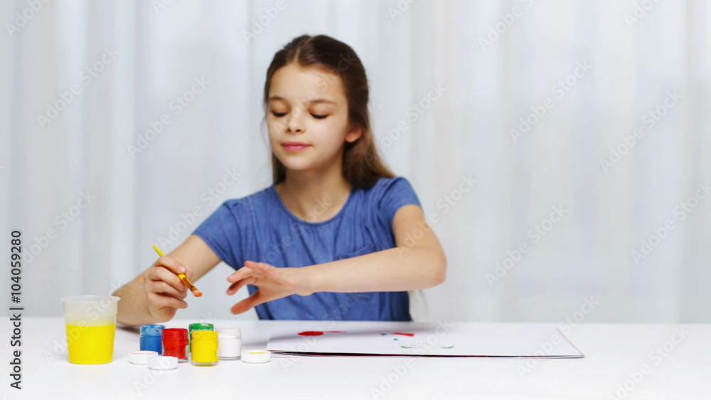 happy girl painting with gouache colour at home happy girl painting with gouache colour at home