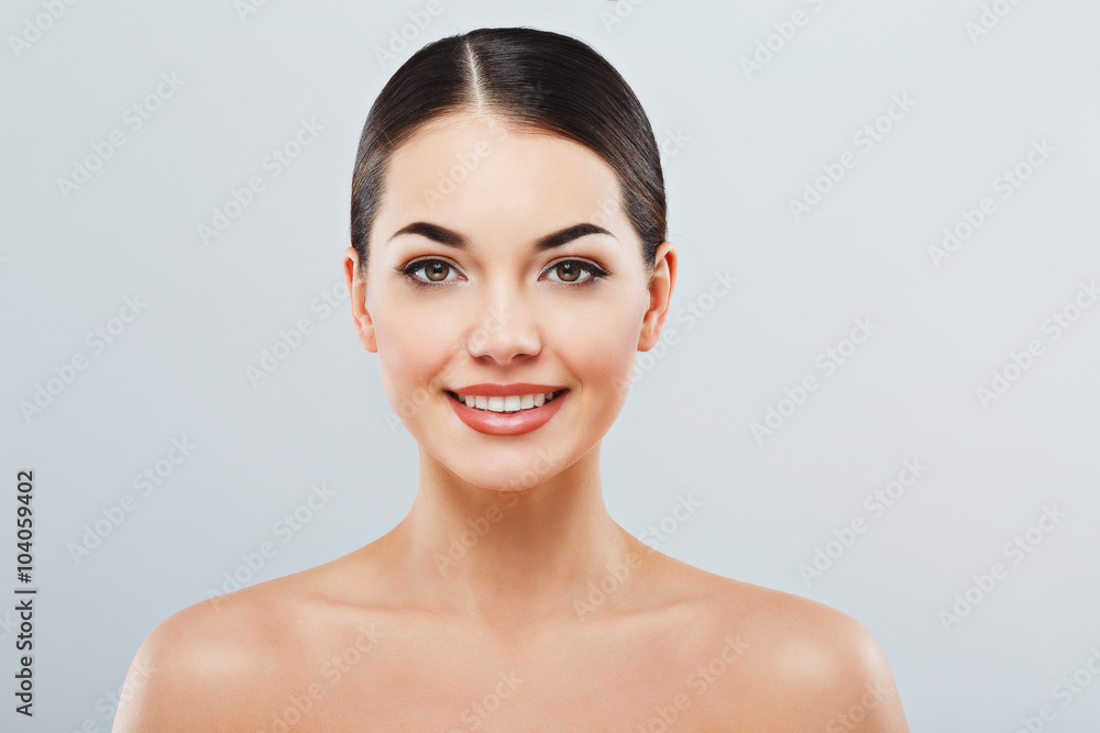 Beautiful girl with dark hair at gray studio background Beautiful girl with dark hair at gray studio background