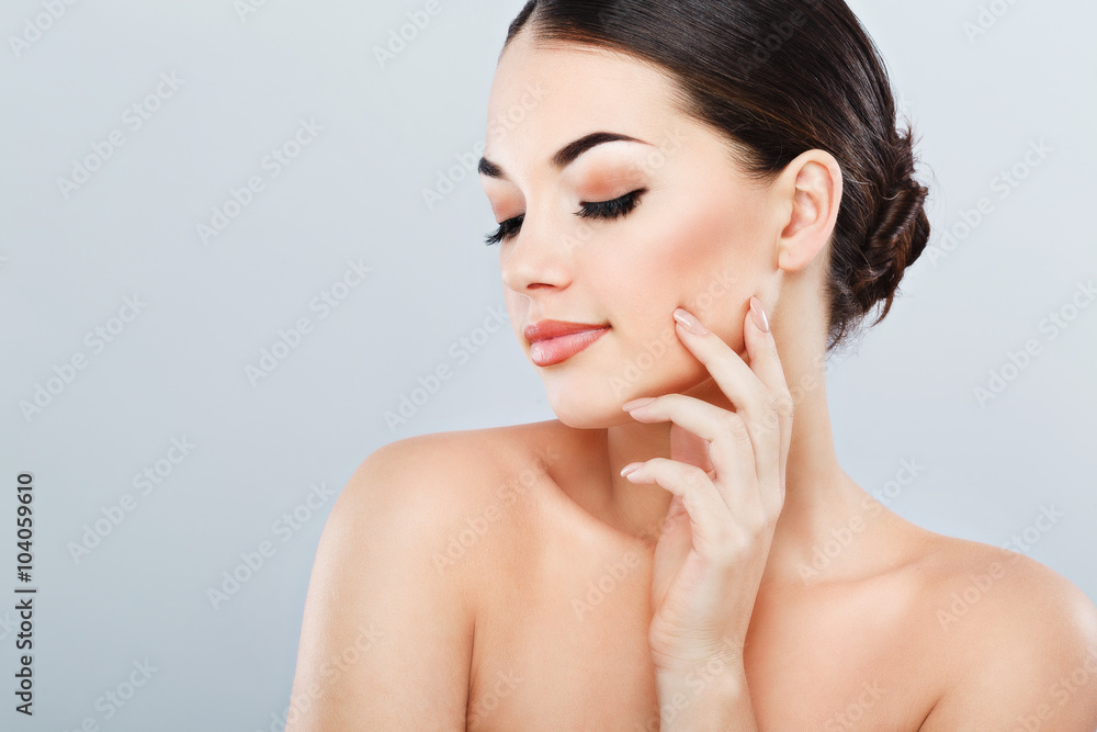 Beautiful girl with dark hair at gray studio background Beautiful girl with dark hair at gray studio background