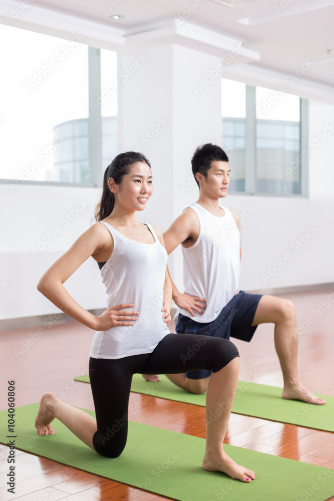 people working out in modern gym people working out in modern gym