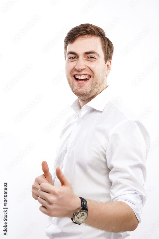Young positive man posing with raised finger and laughing Young positive man posing with raised finger and laughing