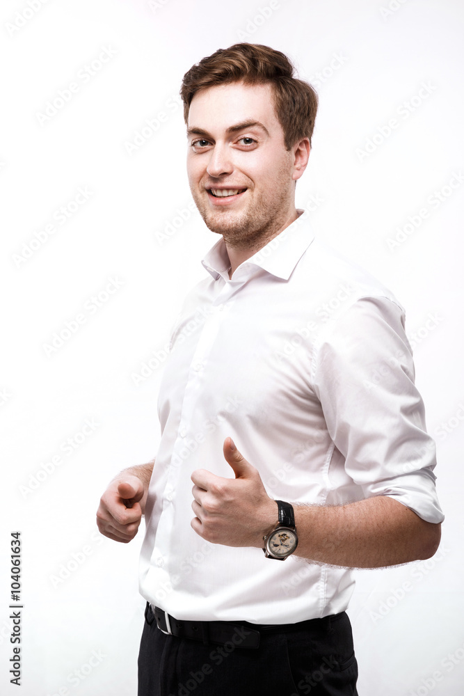 Attractive young man posing with raised finger in studio Attractive young man posing with raised finger in studio