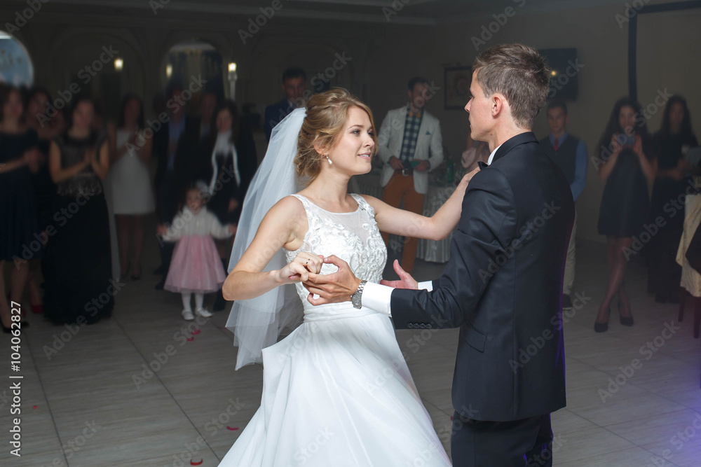the first dance of gentle stylish happy  blonde bride and groom