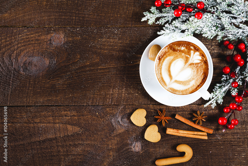 Christmas cookies and coffee on wooden table
