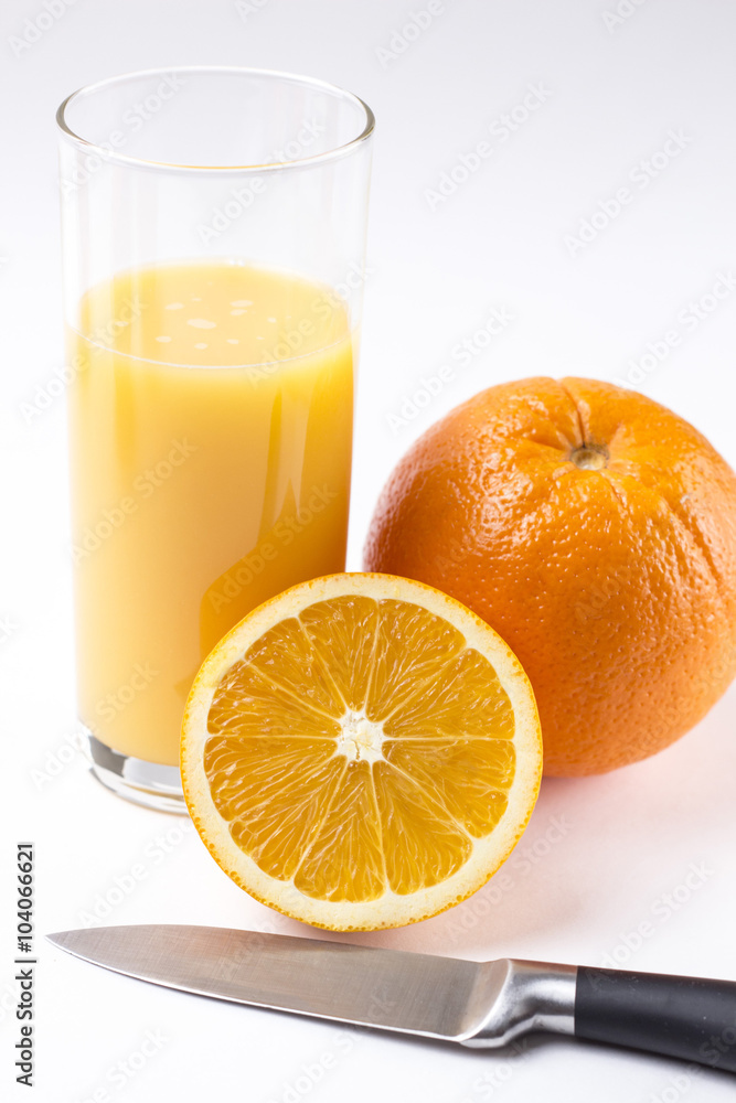 Fresh orange juice in glass with sliced orange Fresh orange juice in glass with sliced orange