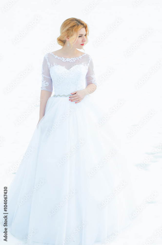 Young and beautiful bride in winter