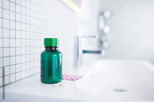 pill bottle standing in the bathroom