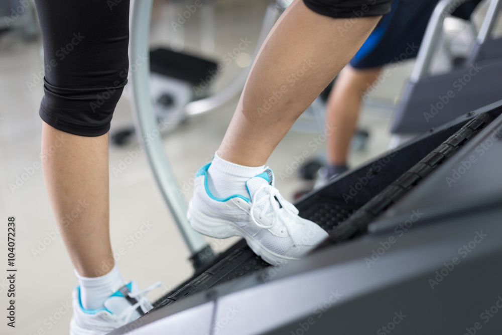 people working out in modern gym people working out in modern gym
