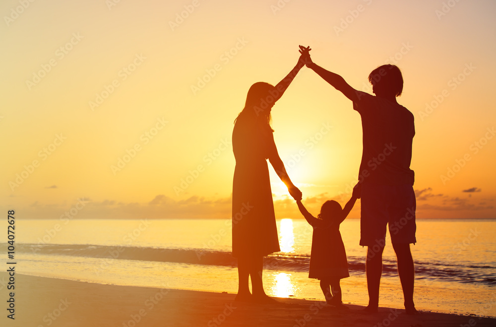 happy family with kid having fun at sunset