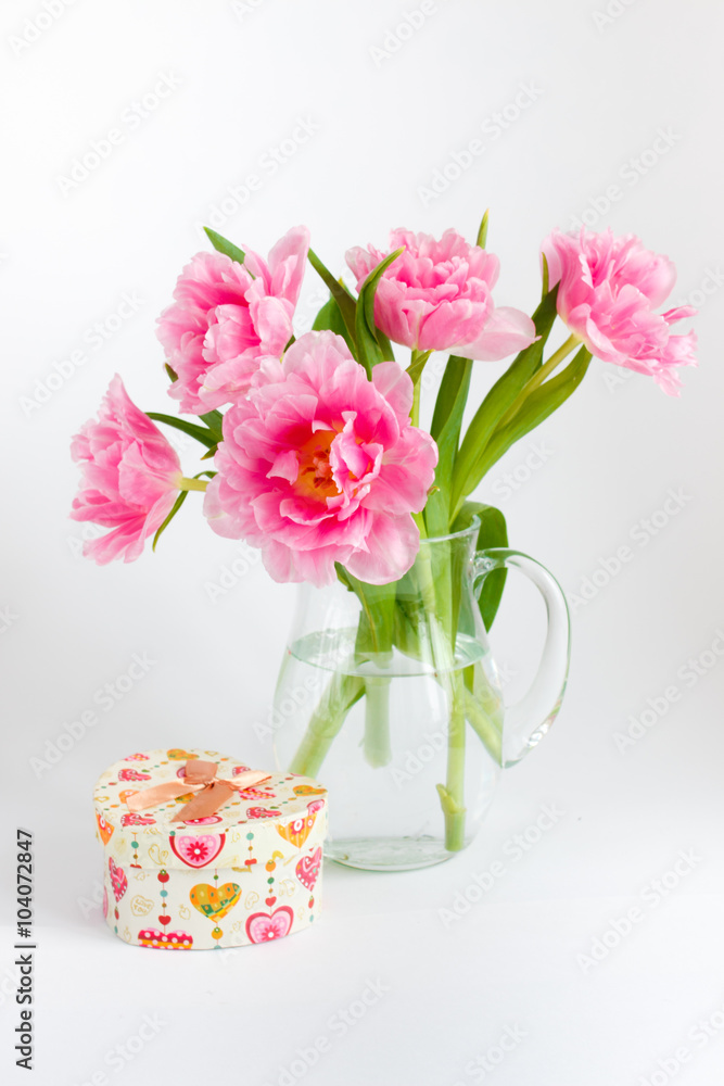 Pink tulips in a glass jar