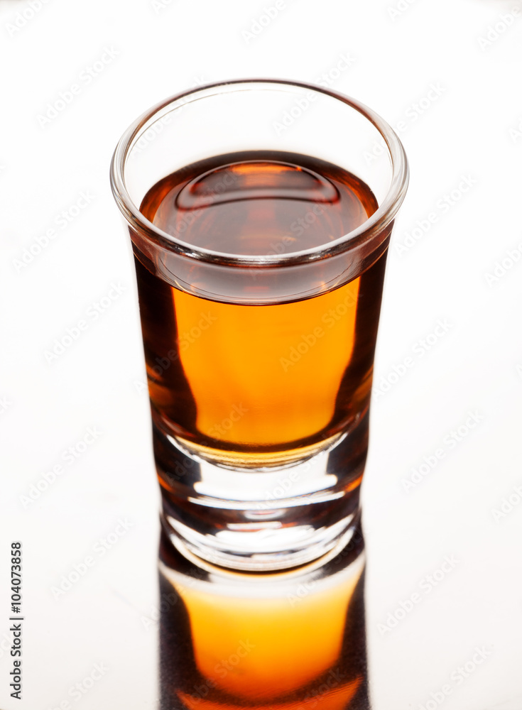 Cold drink with ice in glass on wooden table, selective focus Cold drink with ice in glass on wooden table, selective focus