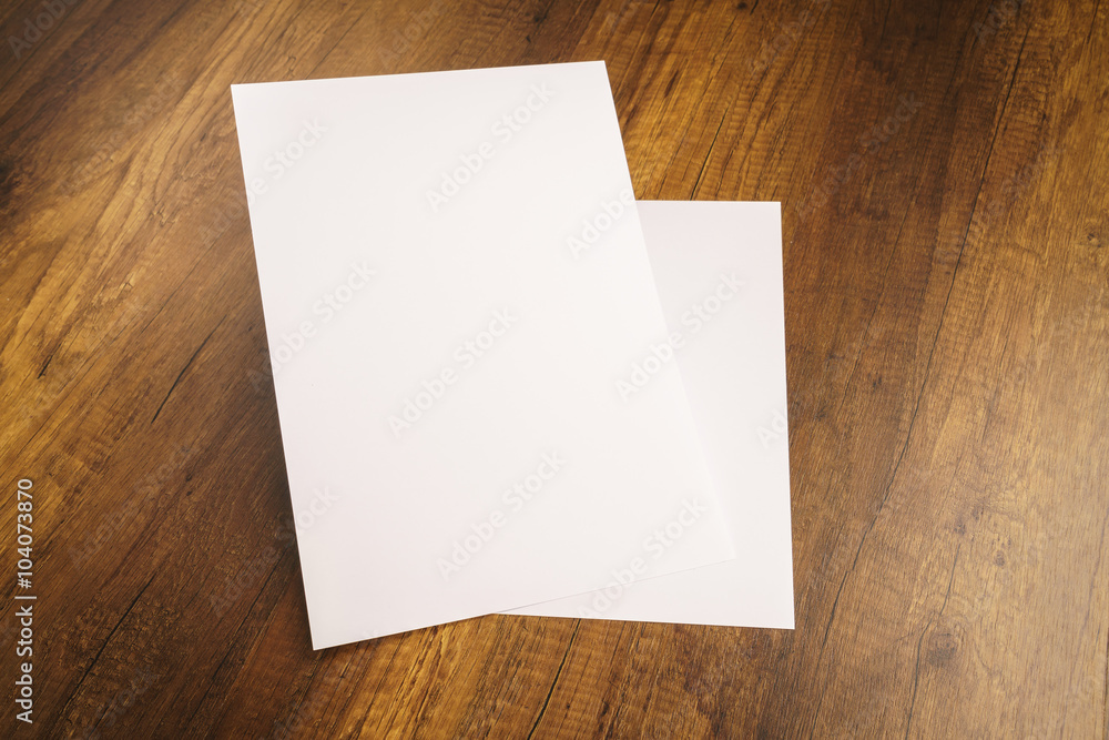 White template paper on wood texture White template paper on wood texture