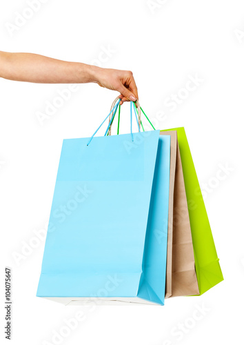 Closeup of womans hand with shopping bags.