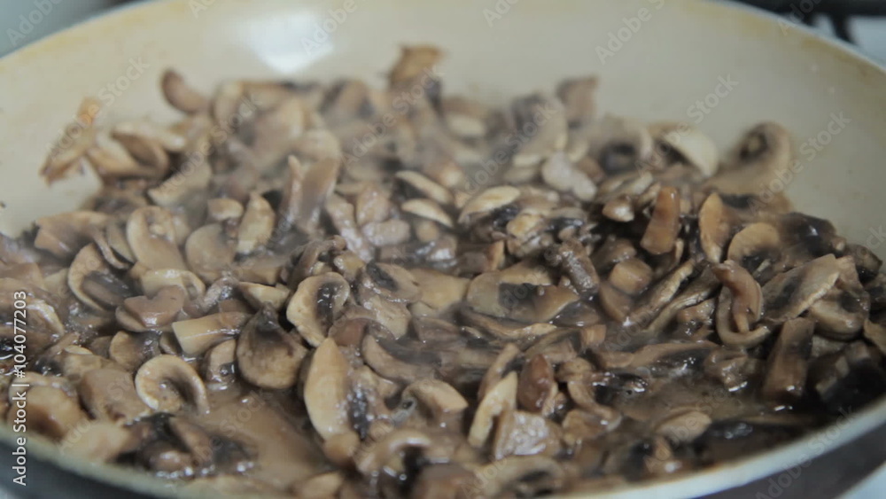 Grinded mushrooms roasting in pan. Grinded mushrooms roasting in pan.