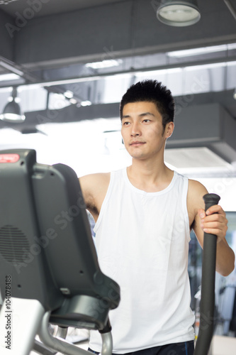 young man working out in modern gym