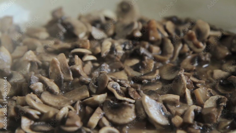 Grinded mushrooms roasting in pan. Grinded mushrooms roasting in pan.