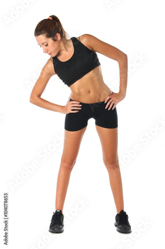 Happy young woman holding doing exercise and stretching over white