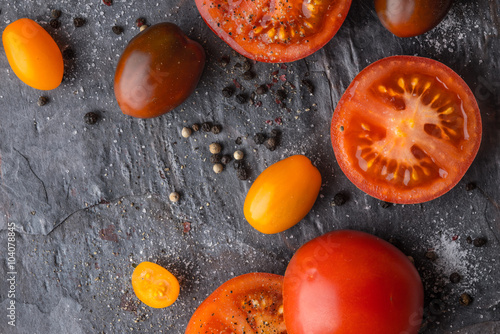 Tomatoes mix  with seasoning on the stone table horizontal