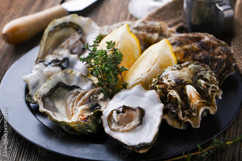 Fresh Oysters in shell with lemon