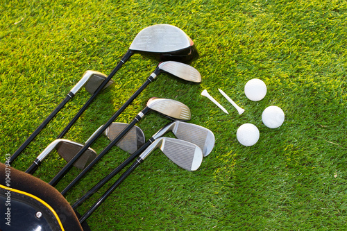 Golf club and Golf ball in bag on grass