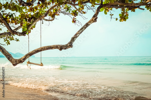 Fototapeta Naklejka Na Ścianę i Meble -  Wooden swing on  tropical beach