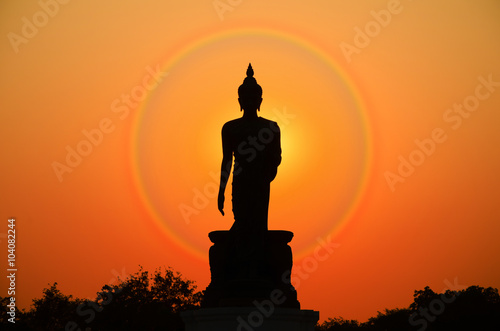 Silhouette of Buddha Statue in Twilight Light.