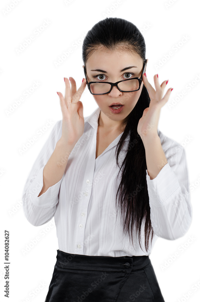 Surprised young woman holding eyeglasses and taking a closer look. White background. Studio shot Surprised young woman holding eyeglasses and taking a closer look. White background. Studio shot