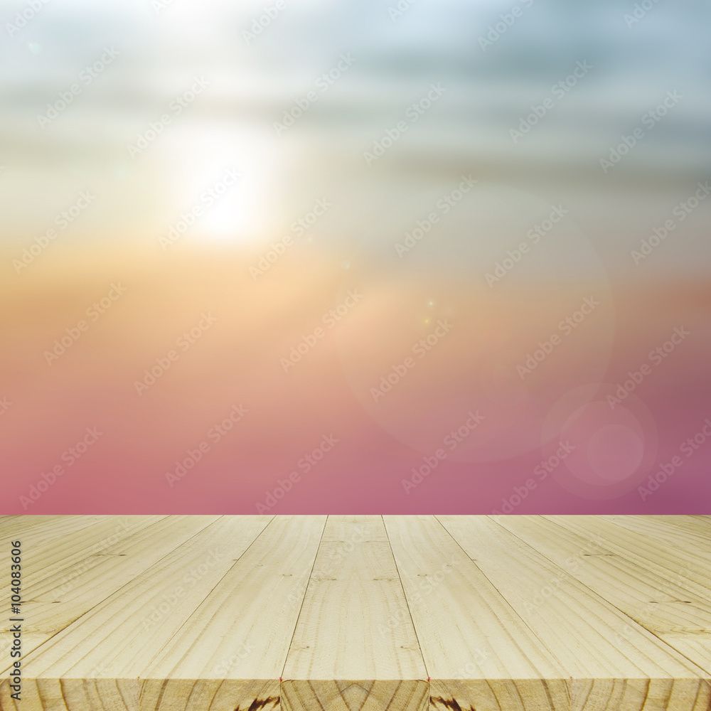 Wood Table and Blurred Sunrise Background. Wood Table and Blurred Sunrise Background.