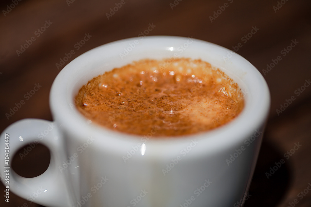 Cup of coffee on a wooden table Cup of coffee on a wooden table