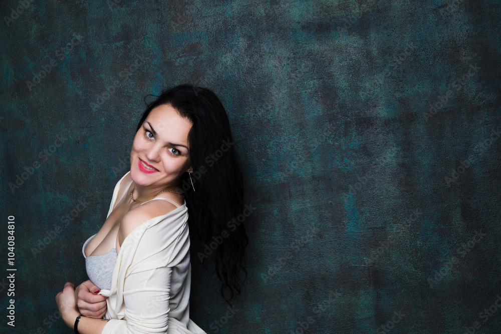Studio portrait of a sexy brunette in grey lingerie and white cardigan Studio portrait of a sexy brunette in grey lingerie and white cardigan