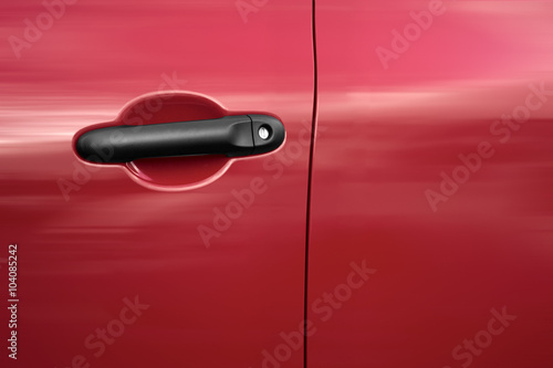 driver's door of a red car