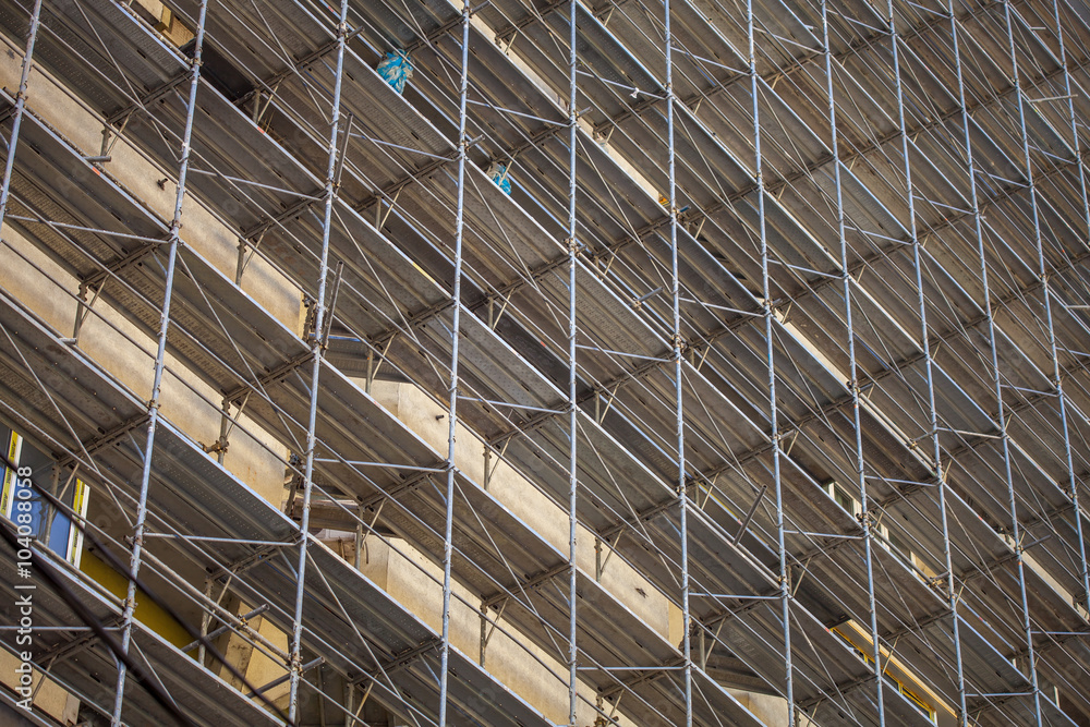 Building under construction, metal scaffolding Building under construction, metal scaffolding