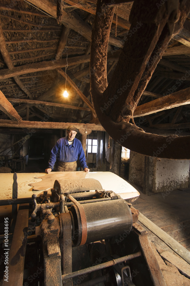 traditional tanner with old tools and machinery in the antique tannery traditional tanner with old tools and machinery in the antique tannery